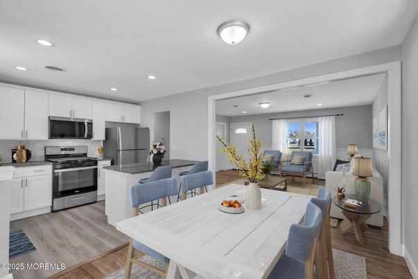 Dining room, Interior, Kitchen, Living room, Recessed Lighting, Stainless Steel Appliances, Wood Texture Flooring