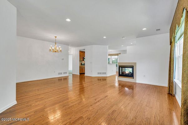Chandelier, Empty room, Fireplace, Interior, Recessed Lighting, Wood Texture Flooring