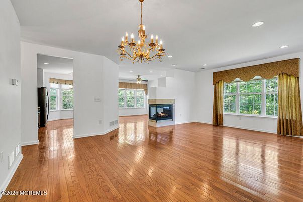 Chandelier, Empty room, Fireplace, Interior, Recessed Lighting, Wood Texture Flooring