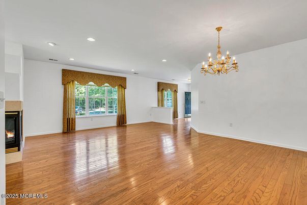 Chandelier, Empty room, Fireplace, Interior, Recessed Lighting, Wood Texture Flooring