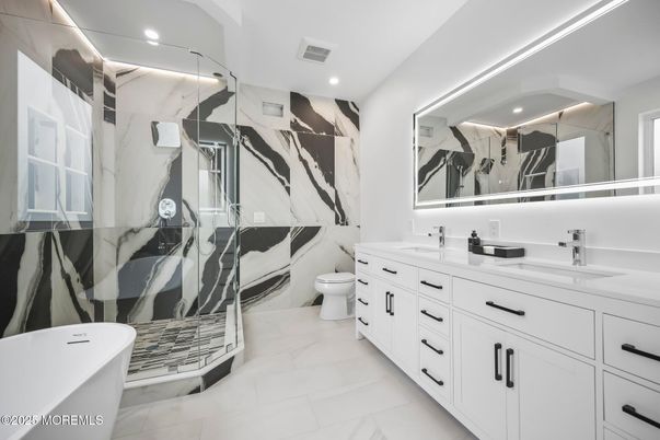 Bathroom, Dual Sink Vanities, Interior, Marble, Marble Walls, Recessed Lighting