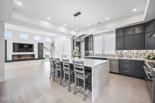 Fireplace, Interior, Kitchen, Pendant Lights, Recessed Lighting, Stainless Steel Appliances, Wood Texture Flooring