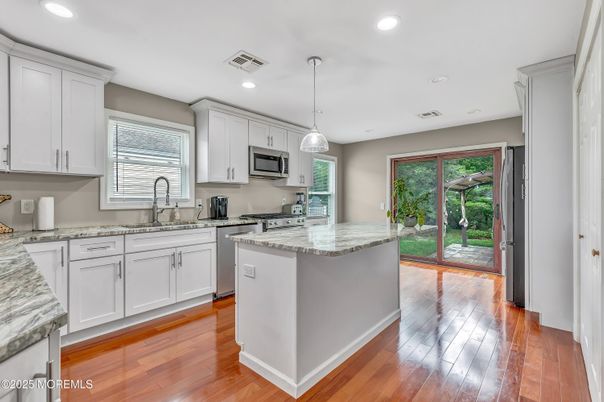 Interior, Kitchen, Pendant Lights, Recessed Lighting, Stainless Steel Appliances, Wood Texture Flooring