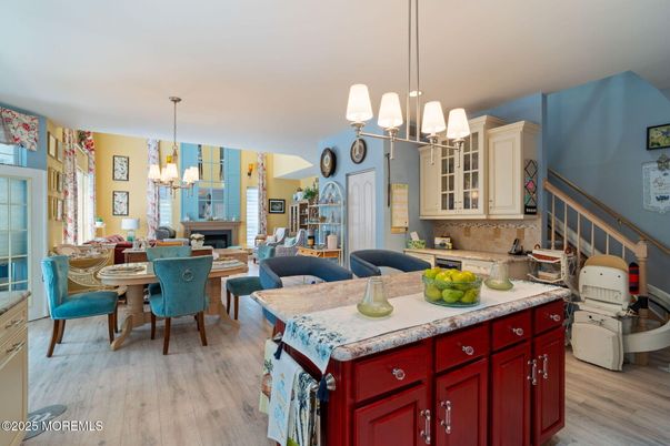 Chandelier, Dining room, Fireplace, Interior, Kitchen, Living room, Pendant Lights, Wood Texture Flooring