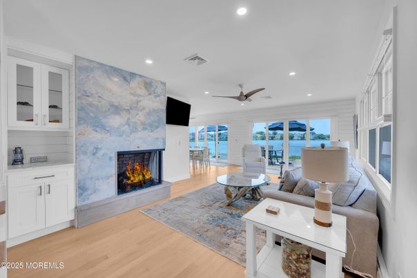 Fireplace, Interior, Living room, Recessed Lighting, Water, Wood Texture Flooring