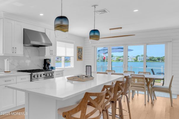 Dining room, Interior, Kitchen, Pendant Lights, Recessed Lighting, Stainless Steel Appliances, Water, Wood Texture Flooring
