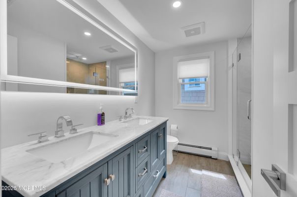 Bathroom, Dual Sink Vanities, Interior, Recessed Lighting, Wood Texture Flooring