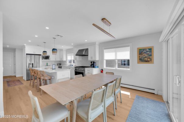 Dining room, Interior, Kitchen, Pendant Lights, Recessed Lighting, Stainless Steel Appliances, Wood Texture Flooring