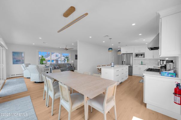 Dining room, Interior, Kitchen, Living room, Pendant Lights, Recessed Lighting, Stainless Steel Appliances, Wood Texture Flooring