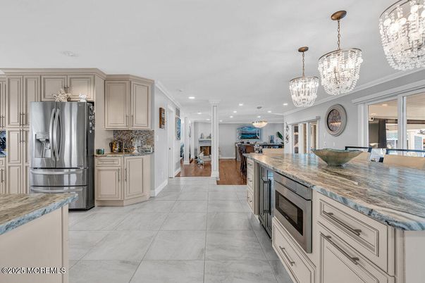 Chandelier, Interior, Kitchen, Living room, Marble, Pendant Lights, Recessed Lighting, Stainless Steel Appliances, Wood Texture Flooring