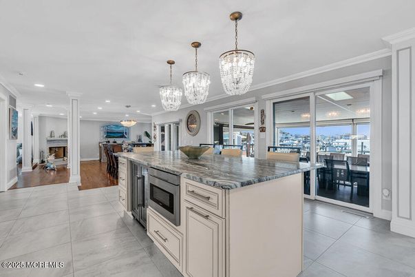 Chandelier, Dining room, Fireplace, Interior, Kitchen, Living room, Marble, Recessed Lighting, Wood Texture Flooring