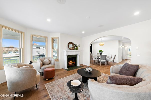 Chandelier, Dining room, Fireplace, Interior, Living room, Recessed Lighting, Wood Texture Flooring