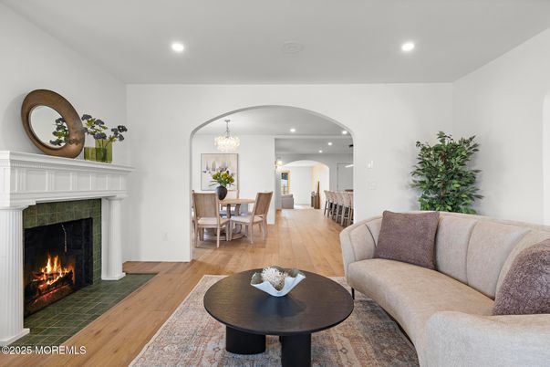 Chandelier, Dining room, Fireplace, Interior, Living room, Recessed Lighting, Wood Texture Flooring