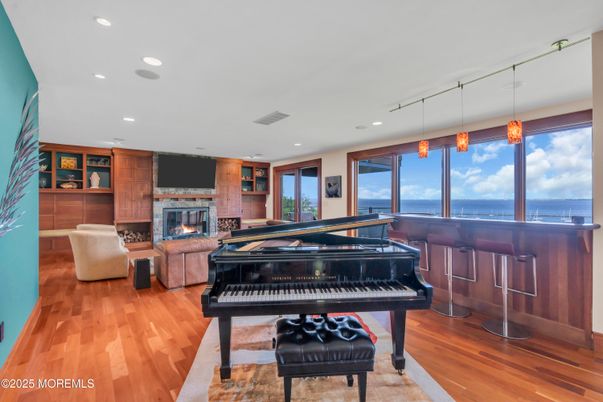 Fireplace, Interior, Living room, Pendant Lights, Piano, Recessed Lighting, Water, Wood Texture Flooring