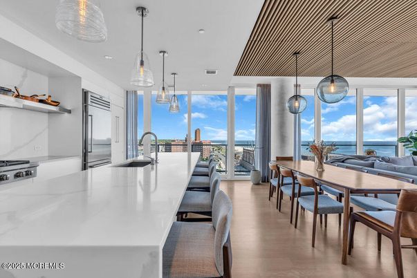 Dining room, Interior, Kitchen, Pendant Lights, Recessed Lighting, Stainless Steel Appliances, Water, Wood Texture Flooring