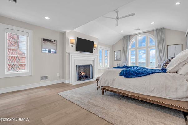 Bedroom, Fireplace, Interior, Recessed Lighting, Wood Texture Flooring