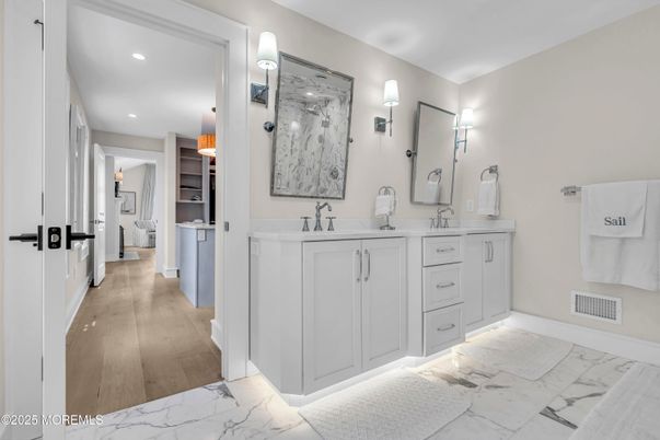 Bathroom, Dual Sink Vanities, Interior, Marble, Recessed Lighting, Wood Texture Flooring