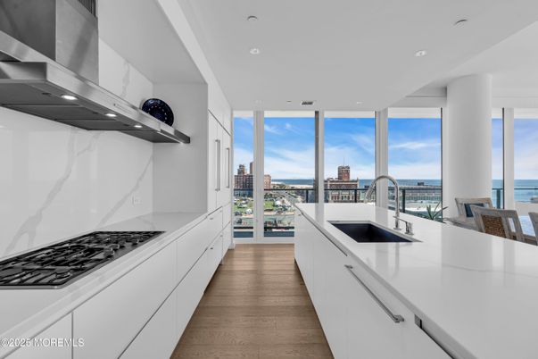 Interior, Kitchen, Marble Walls, Recessed Lighting, Water, Wood Texture Flooring