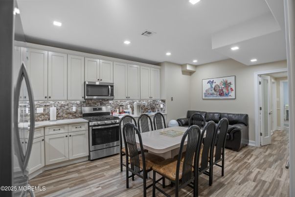 Dining room, Interior, Kitchen, Recessed Lighting, Stainless Steel Appliances, Wood Texture Flooring