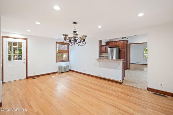 Chandelier, Empty room, Interior, Kitchen, Recessed Lighting, Stainless Steel Appliances, Wood Texture Flooring
