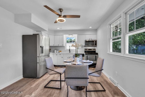Dining room, Interior, Kitchen, Recessed Lighting, Stainless Steel Appliances, Wood Texture Flooring