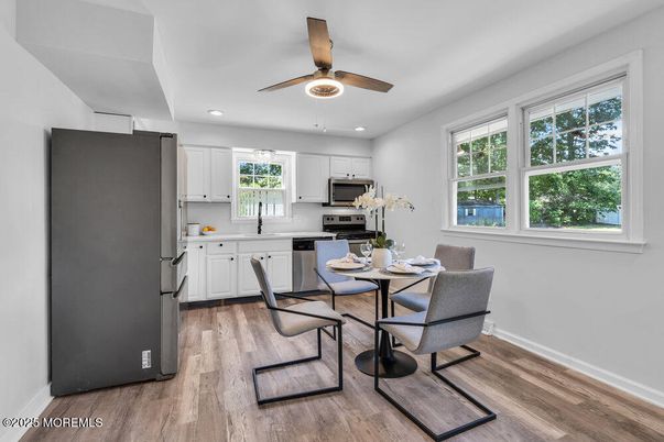 Dining room, Interior, Kitchen, Recessed Lighting, Stainless Steel Appliances, Wood Texture Flooring