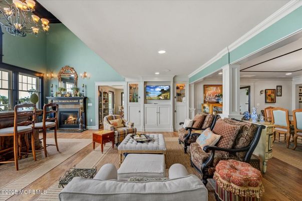 Chandelier, Dining room, Fireplace, Interior, Living room, Recessed Lighting, Wood Texture Flooring