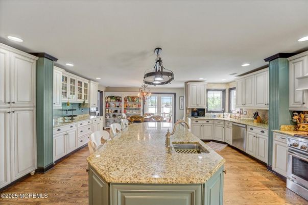 Dining room, Interior, Kitchen, Recessed Lighting, Stainless Steel Appliances, Wood Texture Flooring