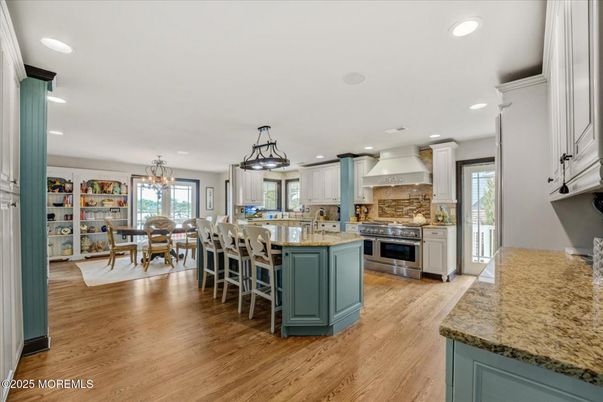 Chandelier, Dining room, Interior, Kitchen, Recessed Lighting, Stainless Steel Appliances, Wood Texture Flooring