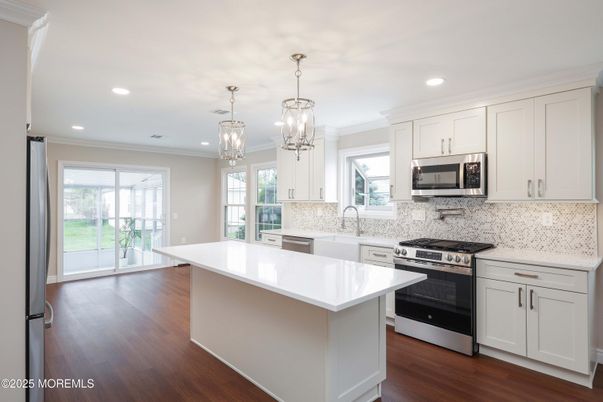 Chandelier, Interior, Kitchen, Pendant Lights, Recessed Lighting, Stainless Steel Appliances, Wood Texture Flooring