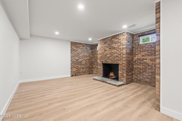 Empty room, Fireplace, Interior, Recessed Lighting, Stone Walls, Wood Texture Flooring