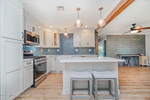 Interior, Kitchen, Pendant Lights, Recessed Lighting, Stainless Steel Appliances, Stone Walls, Wood Texture Flooring