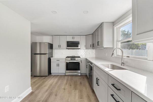 Interior, Kitchen, Recessed Lighting, Stainless Steel Appliances, Wood Texture Flooring