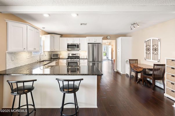 Dining room, Interior, Kitchen, Recessed Lighting, Stainless Steel Appliances, Wood Texture Flooring