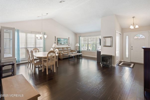 Chandelier, Dining room, Fireplace, Interior, Living room, Pendant Lights, Wood Texture Flooring