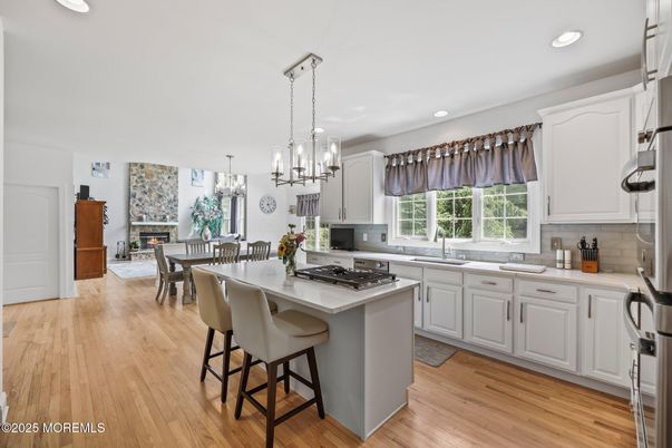 Chandelier, Dining room, Fireplace, Interior, Kitchen, Pendant Lights, Recessed Lighting, Wood Texture Flooring