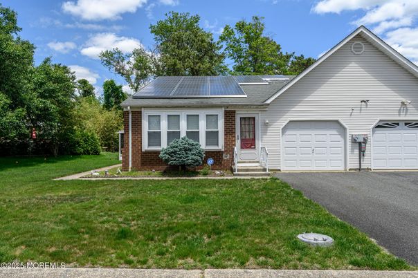 Attached, Exterior, Facade, Brick Facade, Solar Panels, Ranch