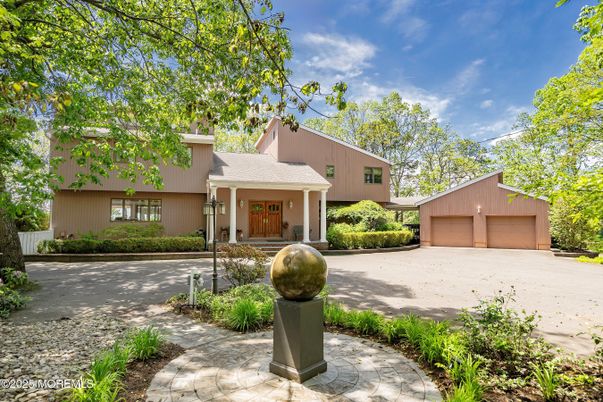 Attached, Backyard, Exterior, Facade, Brick Facade, Raised Ranch