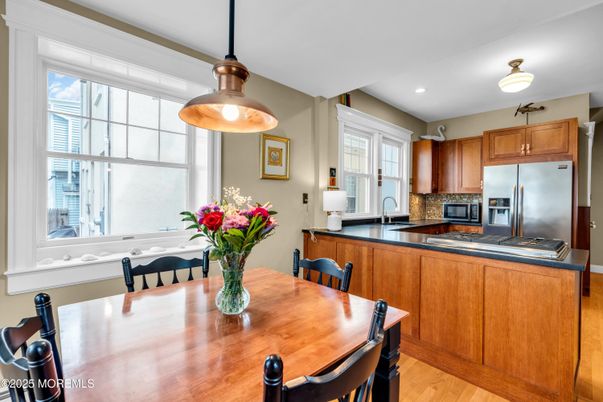 Dining room, Interior, Kitchen, Pendant Lights, Recessed Lighting, Stainless Steel Appliances, Wood Texture Flooring