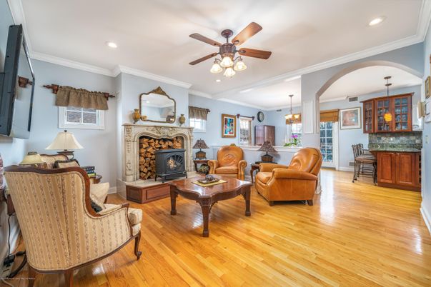 Dining room, Fireplace, Interior, Living room, Pendant Lights, Recessed Lighting, Wood Texture Flooring