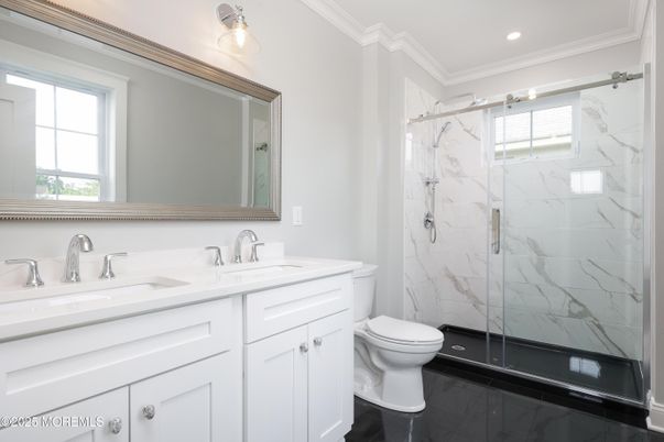 Bathroom, Dual Sink Vanities, Glass Shower, Interior, Marble Walls, Recessed Lighting