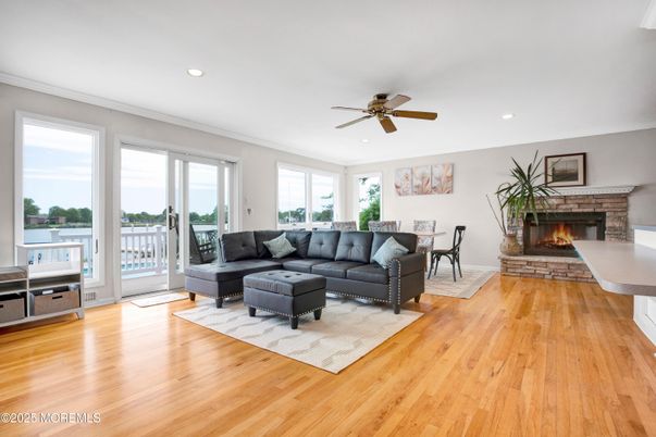 Dining room, Fireplace, Interior, Living room, Recessed Lighting, Wood Texture Flooring