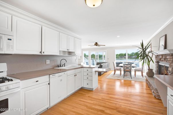 Dining room, Fireplace, Interior, Kitchen, Living room, Recessed Lighting, Wood Texture Flooring