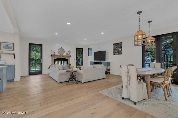 Dining room, Fireplace, Interior, Living room, Pendant Lights, Recessed Lighting, Wood Texture Flooring