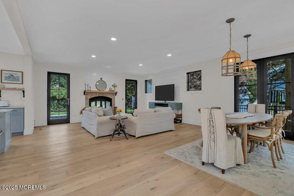 Dining room, Fireplace, Interior, Living room, Pendant Lights, Recessed Lighting, Wood Texture Flooring