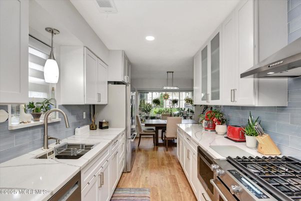 Dining room, Interior, Kitchen, Pendant Lights, Recessed Lighting, Stainless Steel Appliances, Wood Texture Flooring