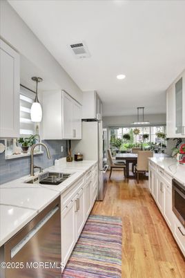 Dining room, Interior, Kitchen, Pendant Lights, Recessed Lighting, Stainless Steel Appliances, Wood Texture Flooring