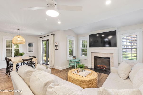Dining room, Fireplace, Interior, Living room, Pendant Lights, Recessed Lighting, Wood Texture Flooring