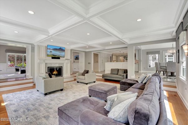 Chandelier, Dining room, Fireplace, Interior, Living room, Pendant Lights, Recessed Lighting, Wood Texture Flooring