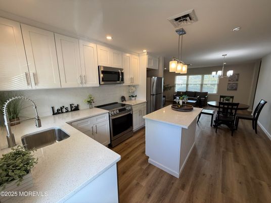 Dining room, Interior, Kitchen, Pendant Lights, Recessed Lighting, Stainless Steel Appliances, Wood Texture Flooring